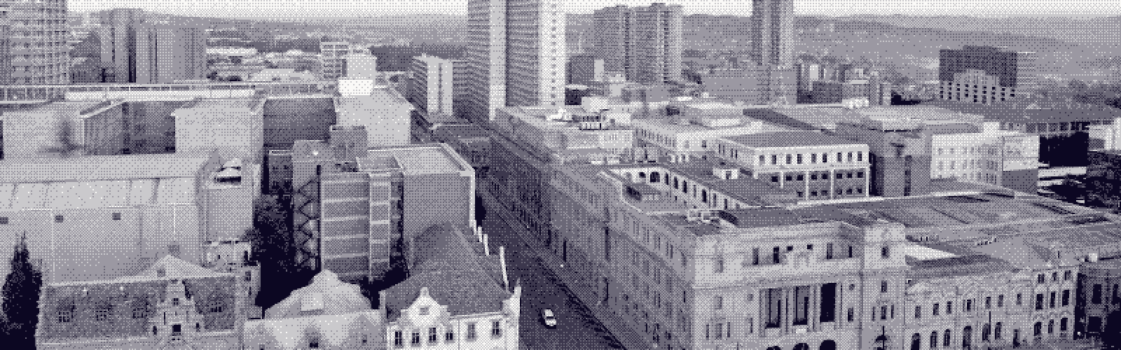 Pretoria's central business district from above, historic facades and office blocks packed back to the horizon