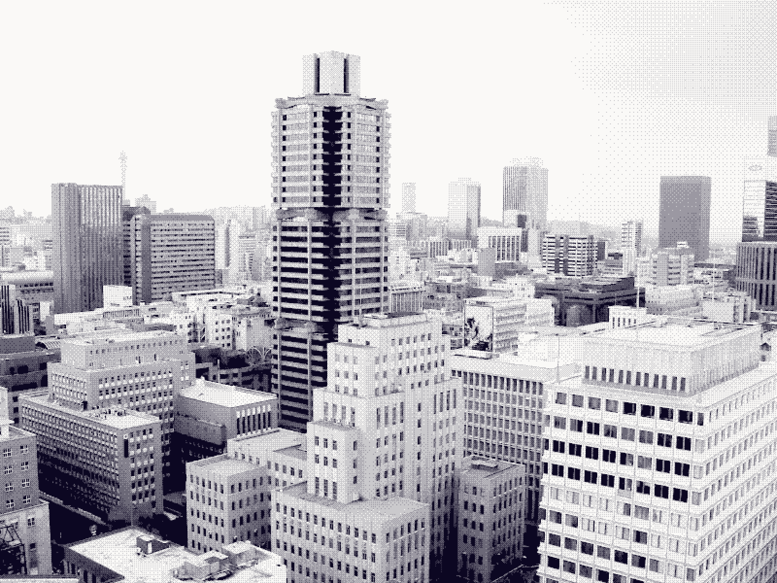 The Johannesburg central business district in black and white, towers layered to the horizon
